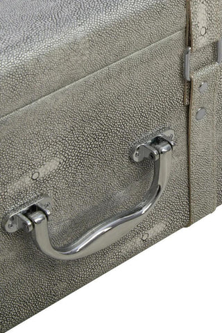 Textured storage trunk close-up with metal handle and faux shagreen finish
