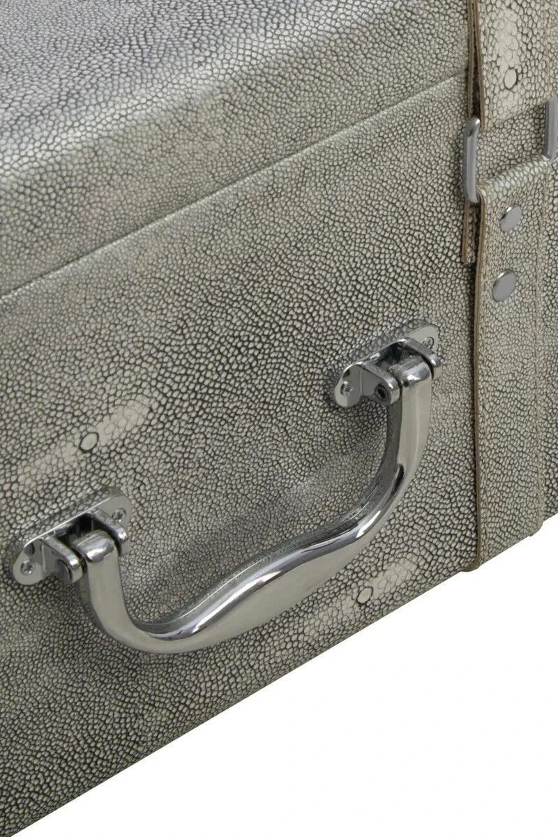 Textured storage trunk close-up with metal handle and faux shagreen finish