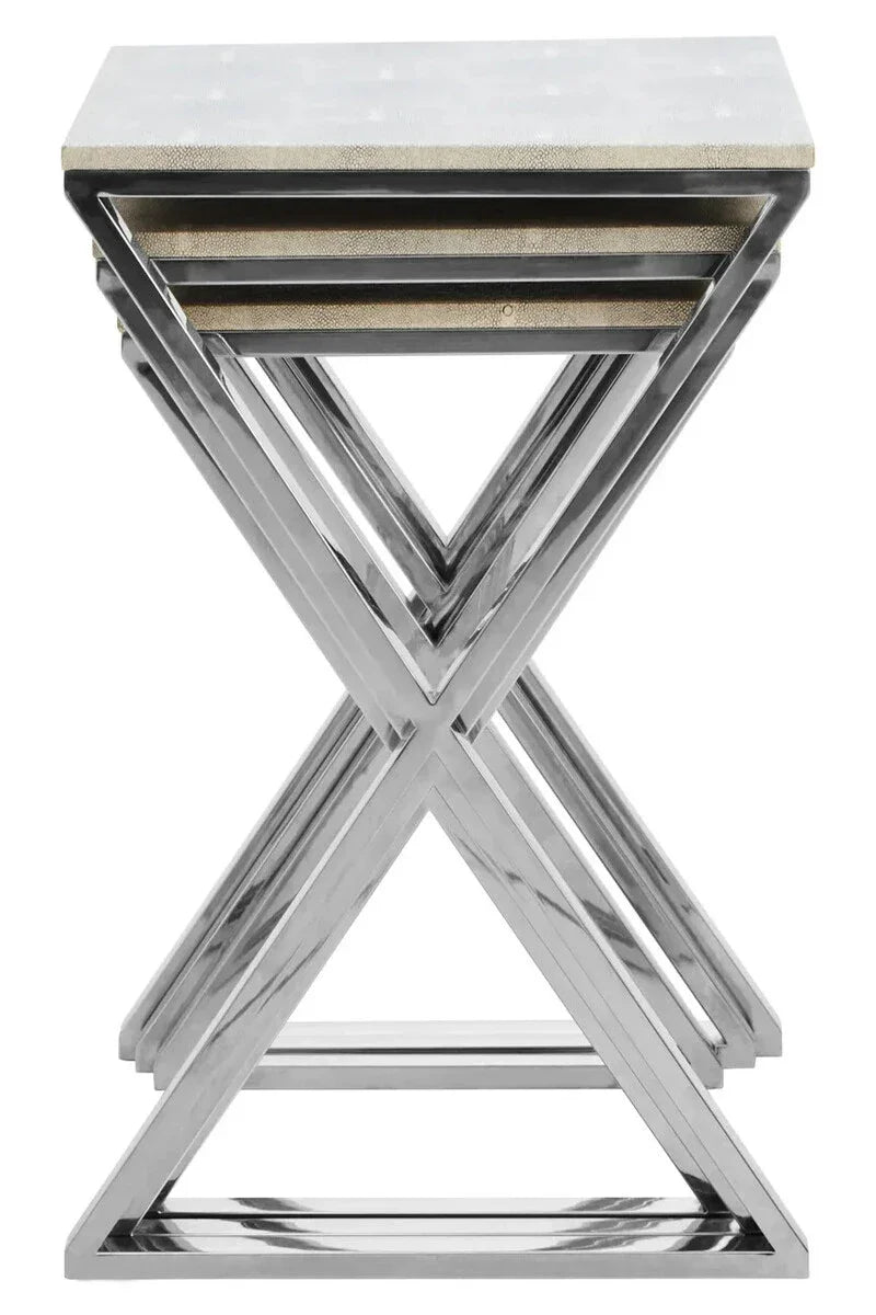 Set of three nesting tables with chrome frames and stone effect tops in a stacked arrangement