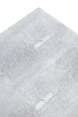 Close up of white faux shagreen furniture surface with textured detail