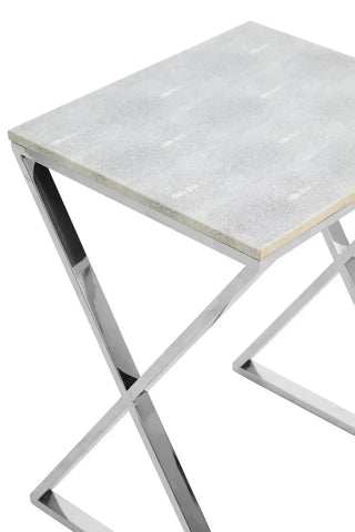 Grey faux shagreen side table with chrome X-leg frame, close-up of tabletop corner