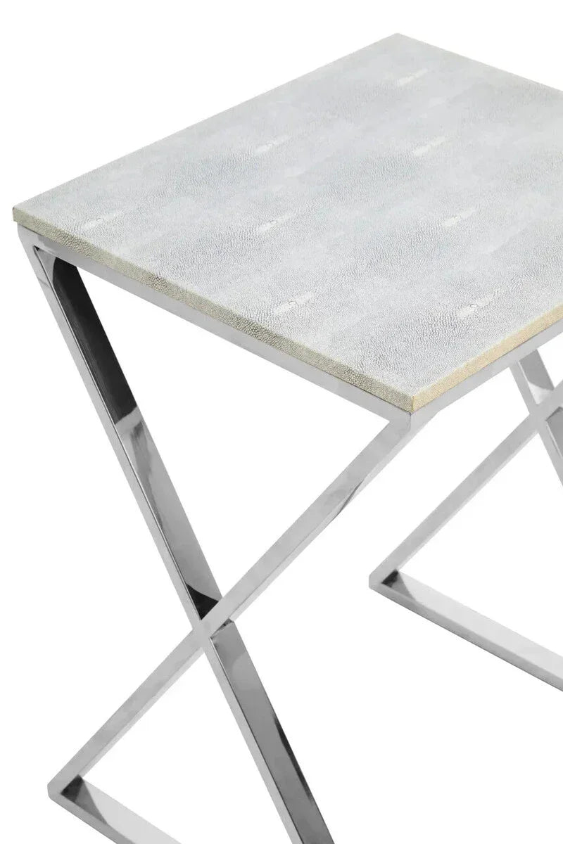 Grey faux shagreen side table with chrome X-leg frame, close-up of tabletop corner