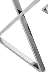 Close-up of chrome table legs with modern geometric design