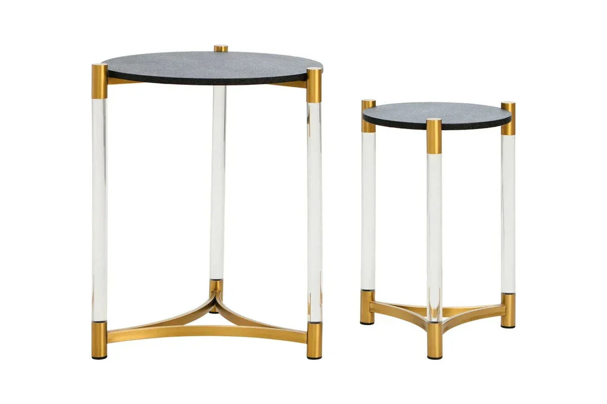 Set of two round side tables with black tops, clear legs, and gold metal accents