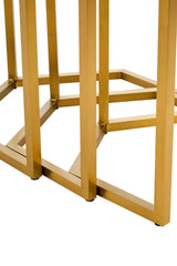 Gold metal table legs with geometric design on white background