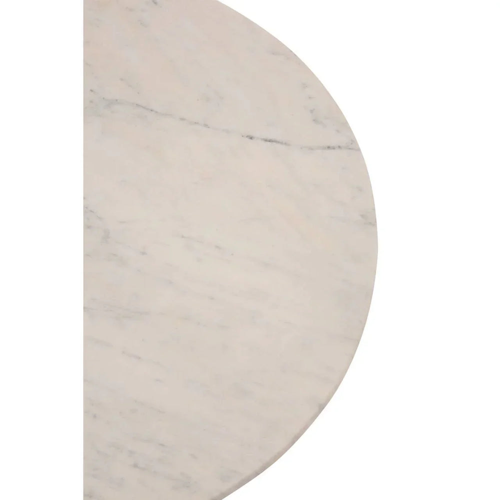 Closeup of round white marble tabletop with natural veining