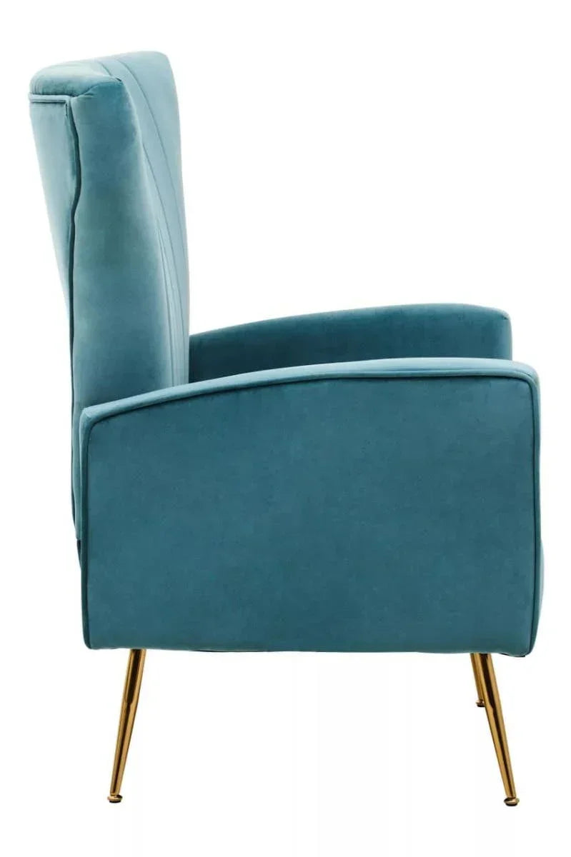 Side view of blue velvet armchair with gold metal legs