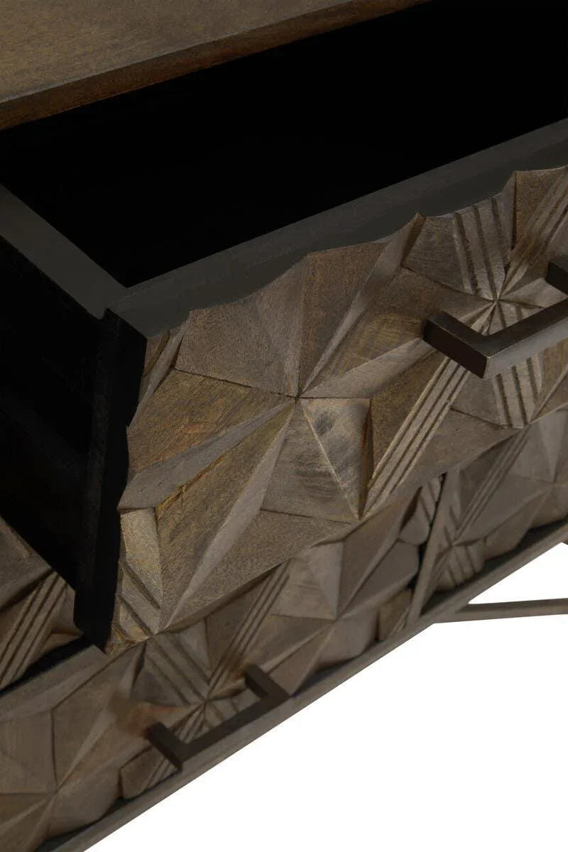 Carved wooden chest of drawers with geometric pattern and metal handles, drawer partially open