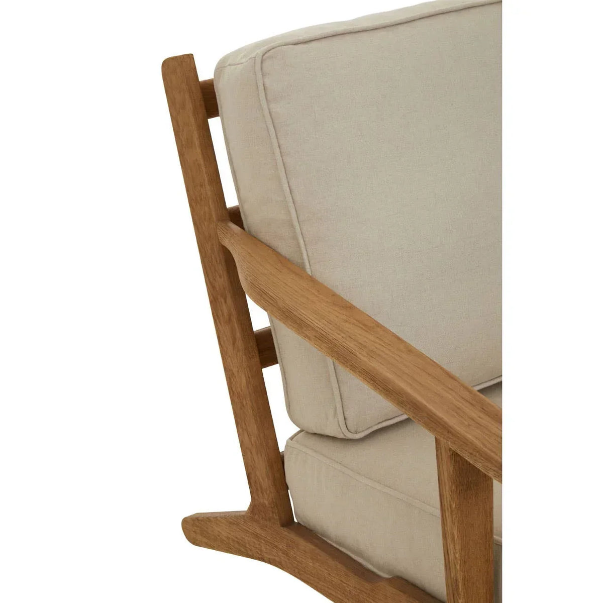 Close-up of wooden armchair with beige fabric cushions and angled oak frame