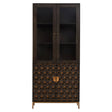 Tall cabinet made of mango wood with a grey finish, featuring two glass-paneled doors at the top and a decorative patterned lower section. The cabinet has a sleek design with a gold-toned handle and stands on slender legs. The interior includes two shelves for storage