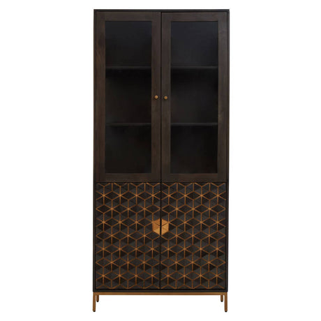 Tall cabinet made of mango wood with a grey finish, featuring two glass-paneled doors at the top and a decorative patterned lower section. The cabinet has a sleek design with a gold-toned handle and stands on slender legs. The interior includes two shelves for storage