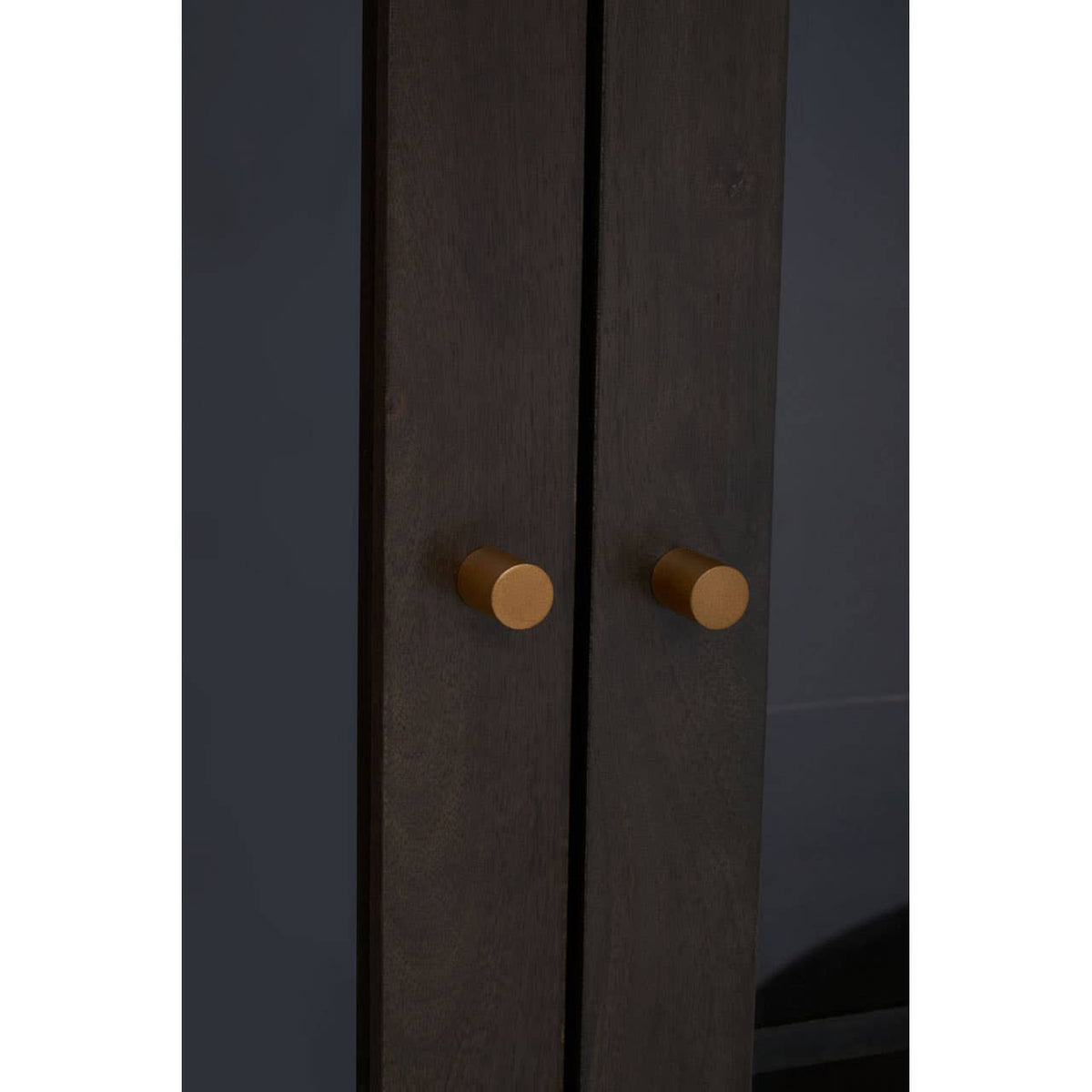 Tall cabinet featuring a grey finish made from mango wood, with two doors and round wooden handles. The cabinet has a sleek design and a minimalist aesthetic, suitable for modern home decor