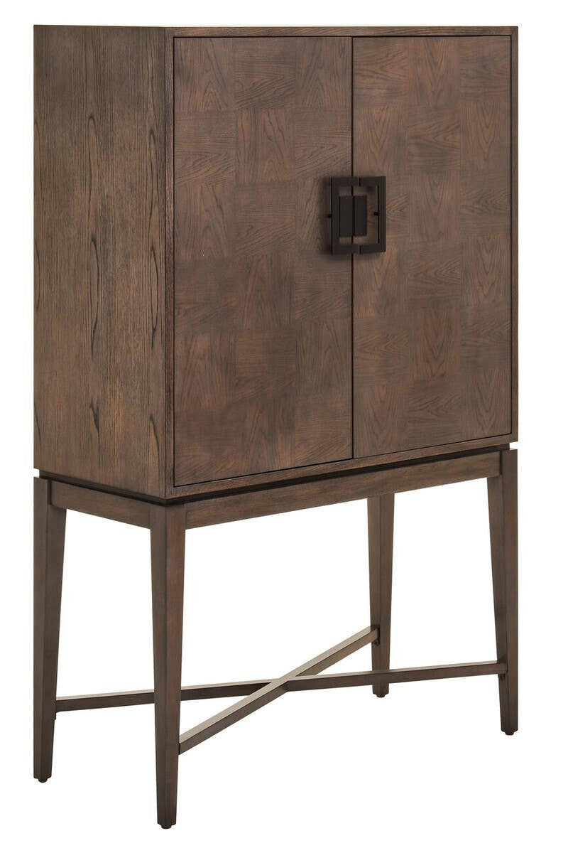 Antique grey cabinet with two doors and a square metal handle, supported by slender legs with a crossbar design at the base. The cabinet features a textured finish that adds a rustic charm