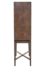 Tall antique grey cabinet with a smooth, flat front and a wooden texture, featuring a simple design and a cross-braced base for stability. The cabinet stands on slender legs, showcasing a minimalist aesthetic suitable for various home decor styles