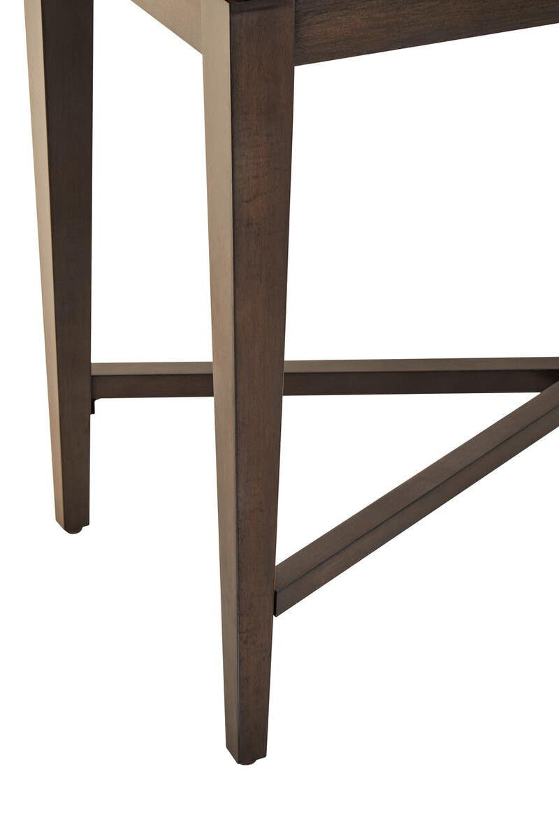 Antique grey cabinet featuring a sleek design with tapered legs and a crossbar support, showcasing a warm, vintage finish