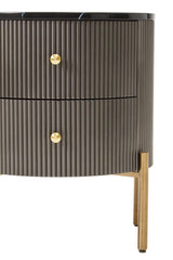 Grey two-drawer chest featuring a black marble top, ribbed texture on the drawer fronts, and gold round handles. The chest stands on slender gold legs, adding a modern touch to the design