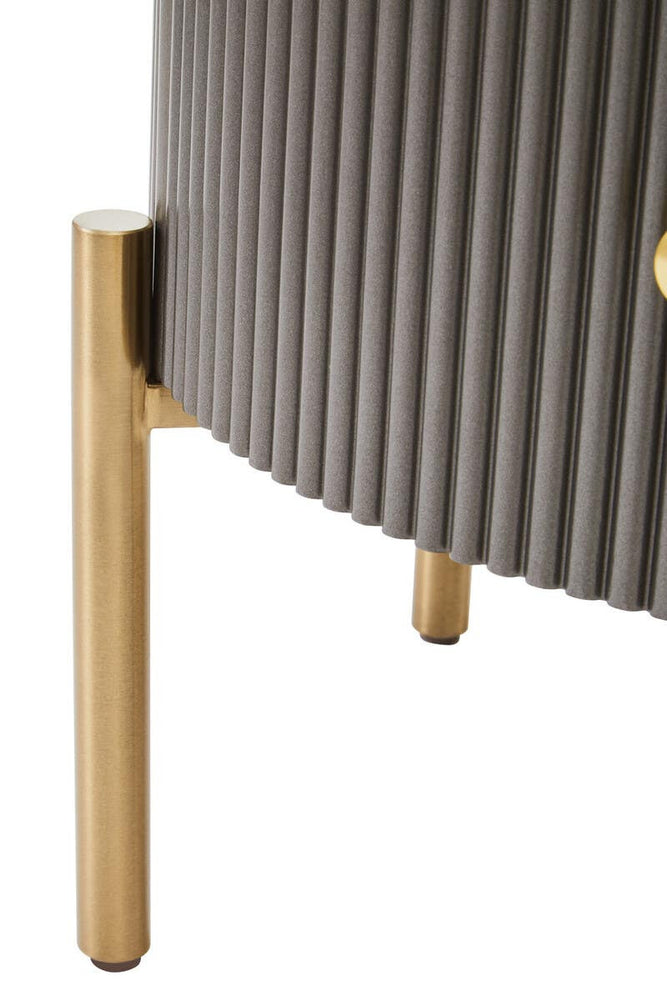 Two drawer chest featuring a grey ribbed body and a sleek black marble top, supported by elegant gold legs. The design combines modern aesthetics with functional storage