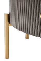 Two drawer chest featuring a grey ribbed body and a sleek black marble top, supported by elegant gold legs. The design combines modern aesthetics with functional storage