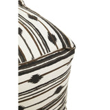 Square pouffe featuring a textured fabric with a geometric pattern of black and cream stripes, showcasing a corner view that highlights its soft edges and contemporary design