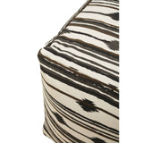 Square pouffe featuring a textured fabric with a black and cream striped pattern, showcasing a corner view that highlights its geometric shape and design details