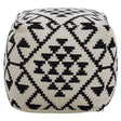 Square pouffe featuring a black and white geometric pattern with triangles and diamonds, designed for home decor. The pouffe has a soft, textured surface and rounded edges, making it suitable for use as a footrest or additional seating