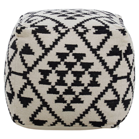 Square pouffe featuring a black and white geometric pattern with triangles and diamonds, designed for home decor. The pouffe has a soft, textured surface and rounded edges, making it suitable for use as a footrest or additional seating
