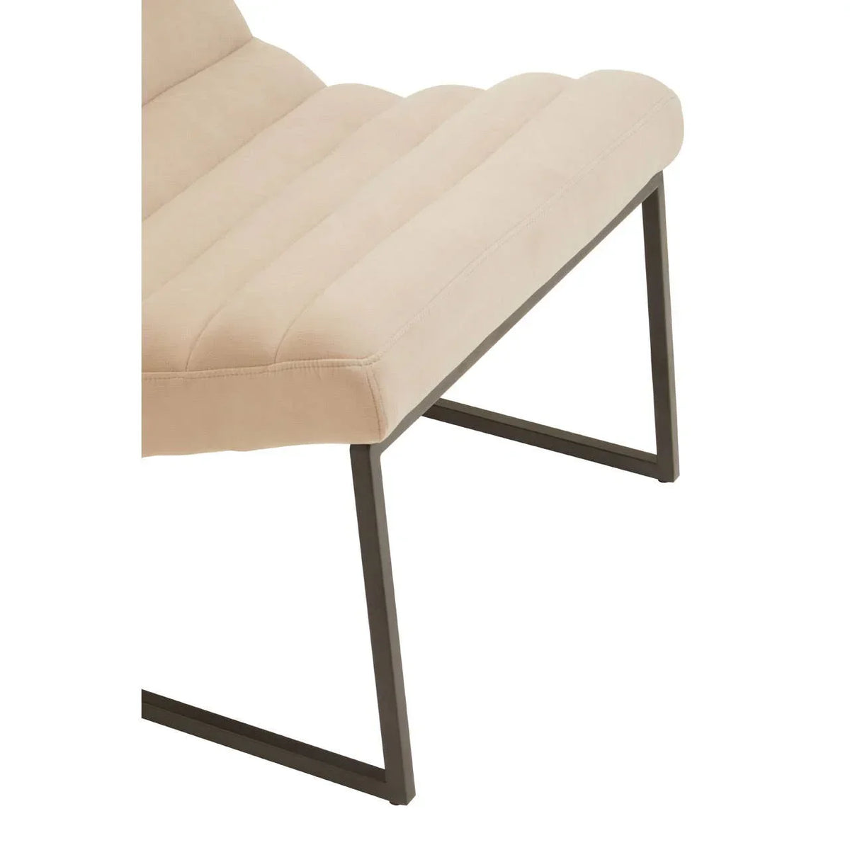 Beige upholstered dining chair with black metal legs, side angle view