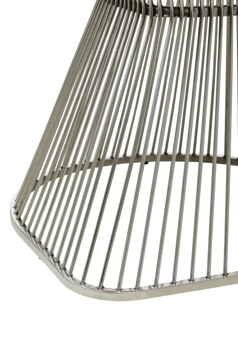 Brushed steel dining table base with vertical metal rods and geometric design