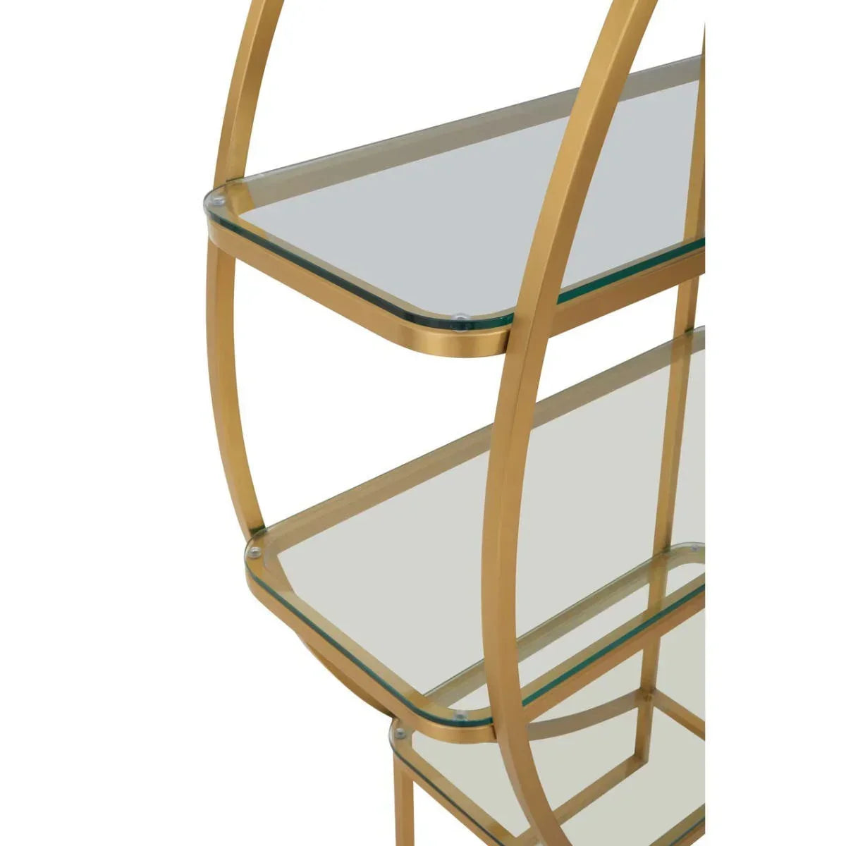 Closeup of gold metal frame shelving unit with clear glass shelves and rounded edges