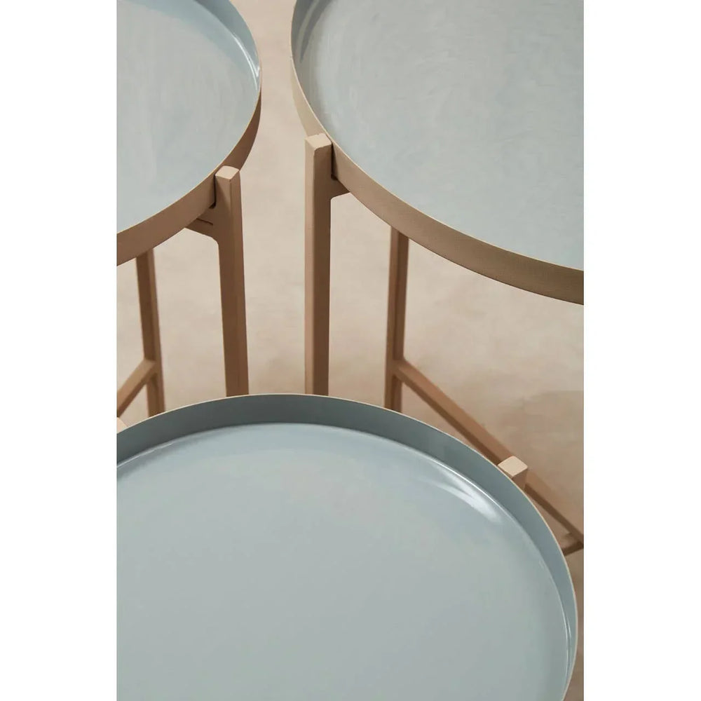 Set of round nesting side tables with light wood legs and pale blue tray tops