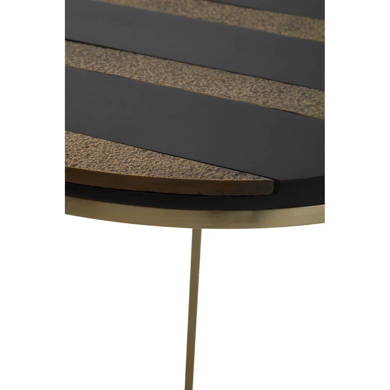Round side table with black and gold textured top and slim gold metal legs