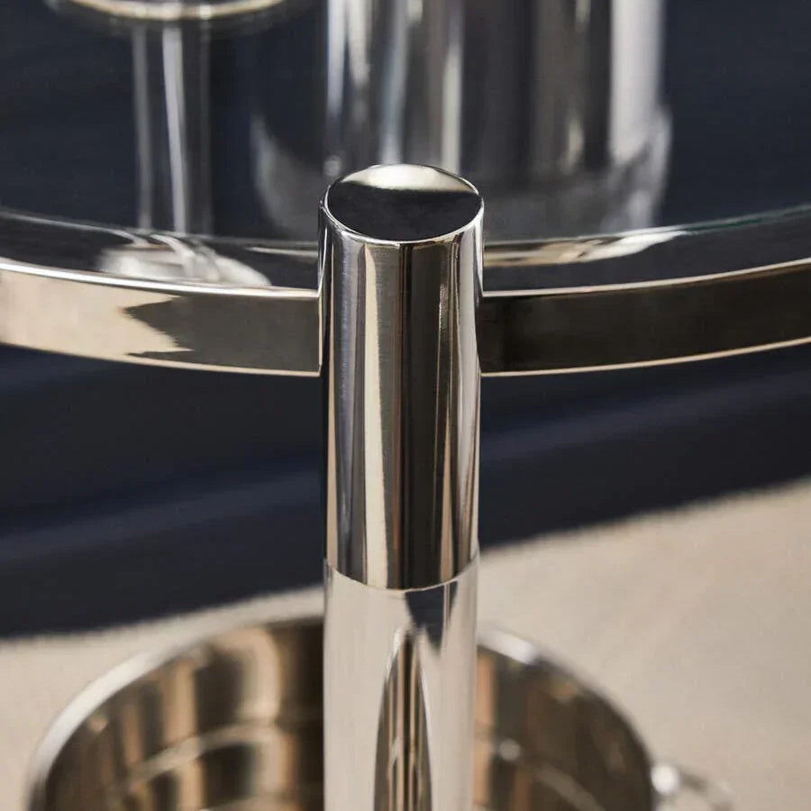 Close view of chrome bar cart frame with glass top and wine bucket underneath