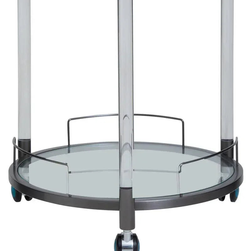 Glass serving trolley with round metal frame and caster wheels, close-up of lower shelf