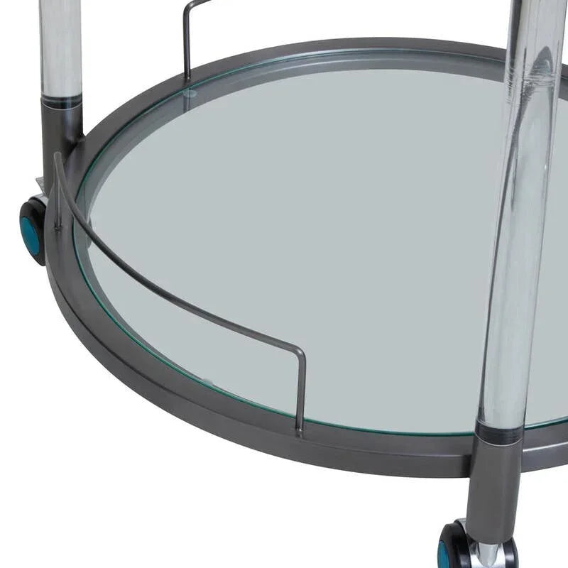 Close view of glass and metal serving trolley bottom shelf with wheels