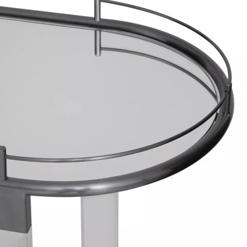 Glass top side table with silver metal frame and curved rail detail