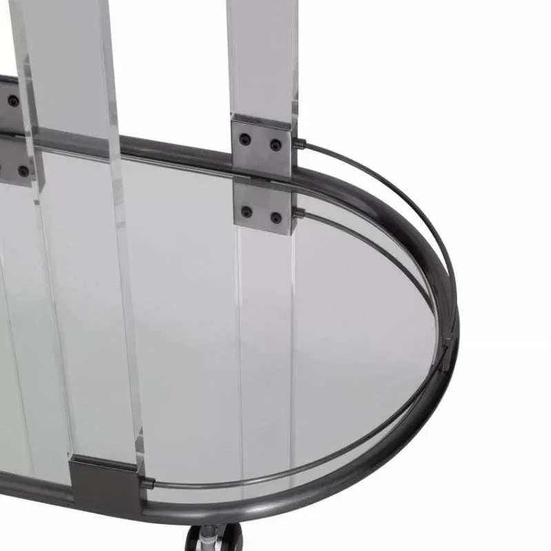 Glass and chrome bar trolley with acrylic legs and visible swivel caster wheel