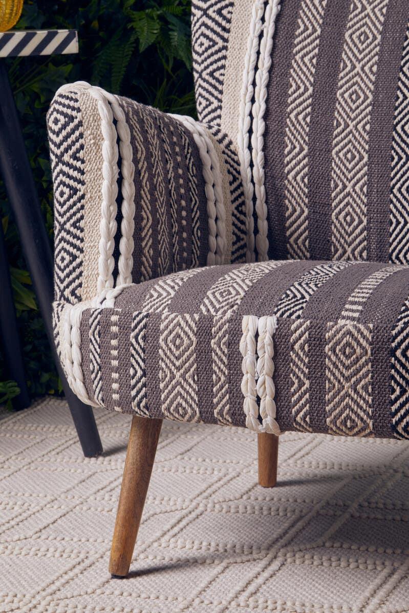 Striped patterned accent chair with wooden legs and textured upholstery