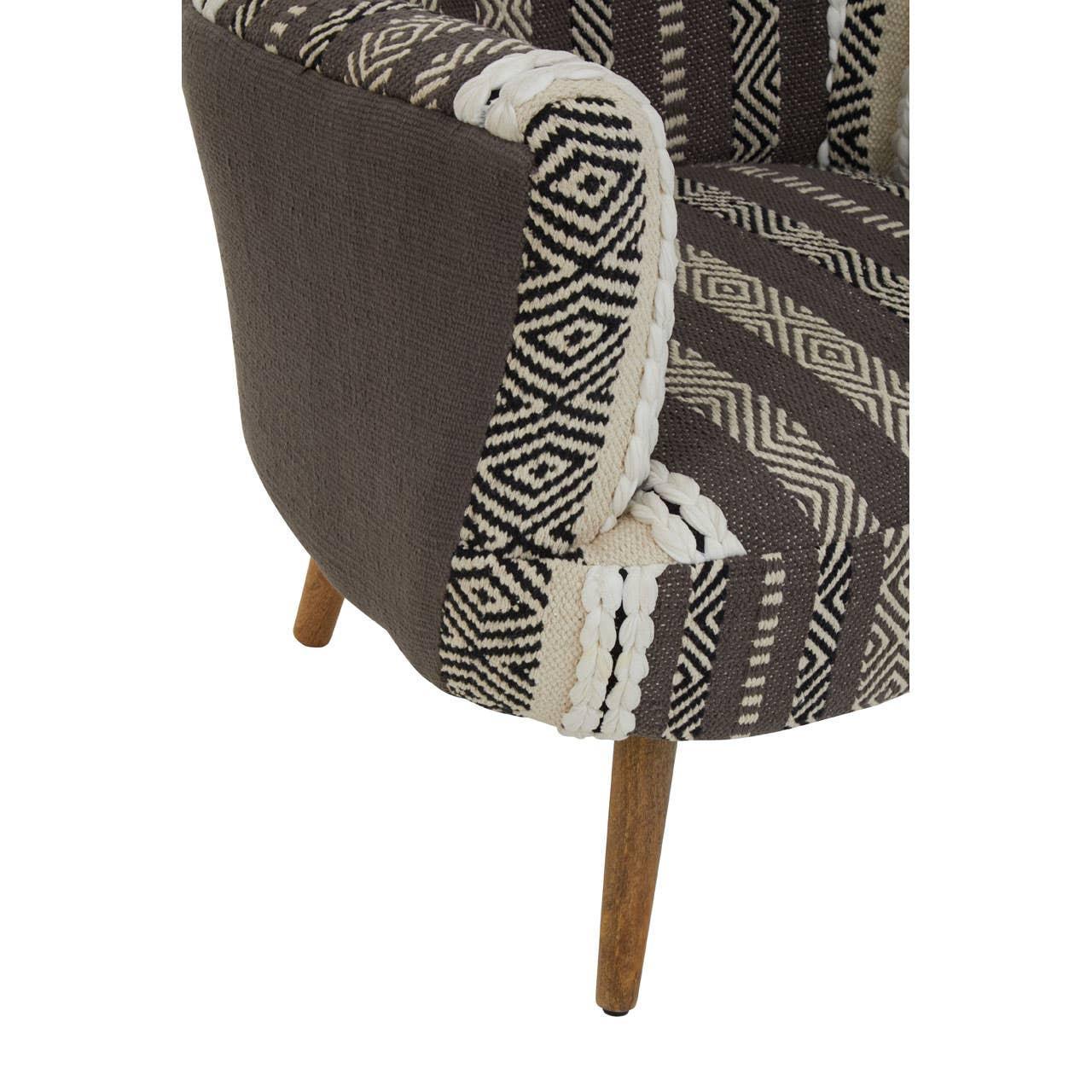 Patterned fabric accent chair with wooden legs and geometric black and cream upholstery
