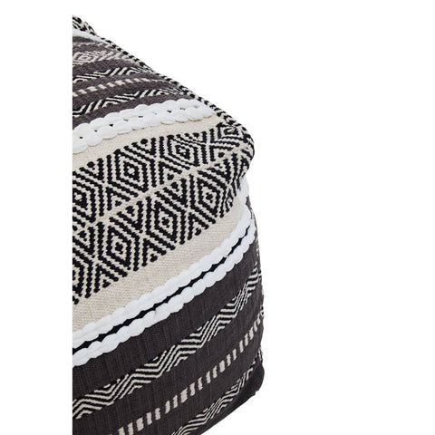 A close-up view of a grey and white pouffe featuring a geometric pattern with alternating stripes and textures, showcasing a soft, textured fabric. The pouffe has a rounded shape and is designed for versatile use in home decor