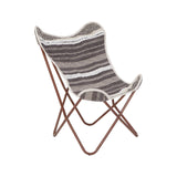 A butterfly chair featuring a grey and white striped fabric seat with a soft texture, supported by a sleek, brown metal frame that creates a modern and stylish look. The chair's unique shape and open design make it suitable for both indoor and outdoor use