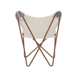 A grey and white butterfly chair featuring a cream-colored fabric seat supported by a sleek, brown metal frame with crossed legs. The chair has a minimalist design, showcasing a modern aesthetic suitable for various home decor styles