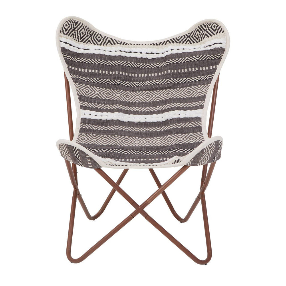 A butterfly chair featuring a grey and white striped fabric seat with a soft texture, supported by a sturdy brown metal frame that forms a cross design at the base. The chair's unique shape and colors make it a stylish addition to any home decor