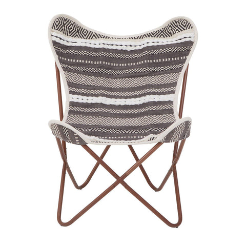 A butterfly chair featuring a grey and white striped fabric seat with a soft texture, supported by a sturdy brown metal frame that forms a cross design at the base. The chair's unique shape and colors make it a stylish addition to any home decor