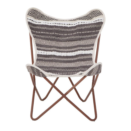 A butterfly chair featuring a grey and white striped fabric seat with a soft texture, supported by a sturdy brown metal frame that forms a cross design at the base. The chair's unique shape and colors make it a stylish addition to any home decor