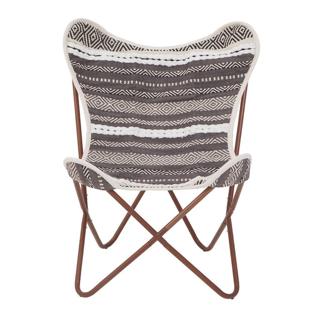 A butterfly chair featuring a grey and white striped fabric seat with a soft texture, supported by a sturdy brown metal frame that forms a cross design at the base. The chair's unique shape and colors make it a stylish addition to any home decor