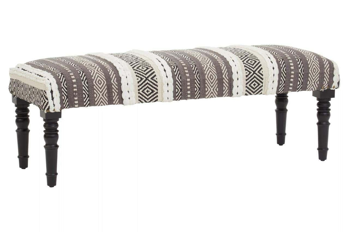 upholstered bench with black and white geometric fabric and turned wooden legs