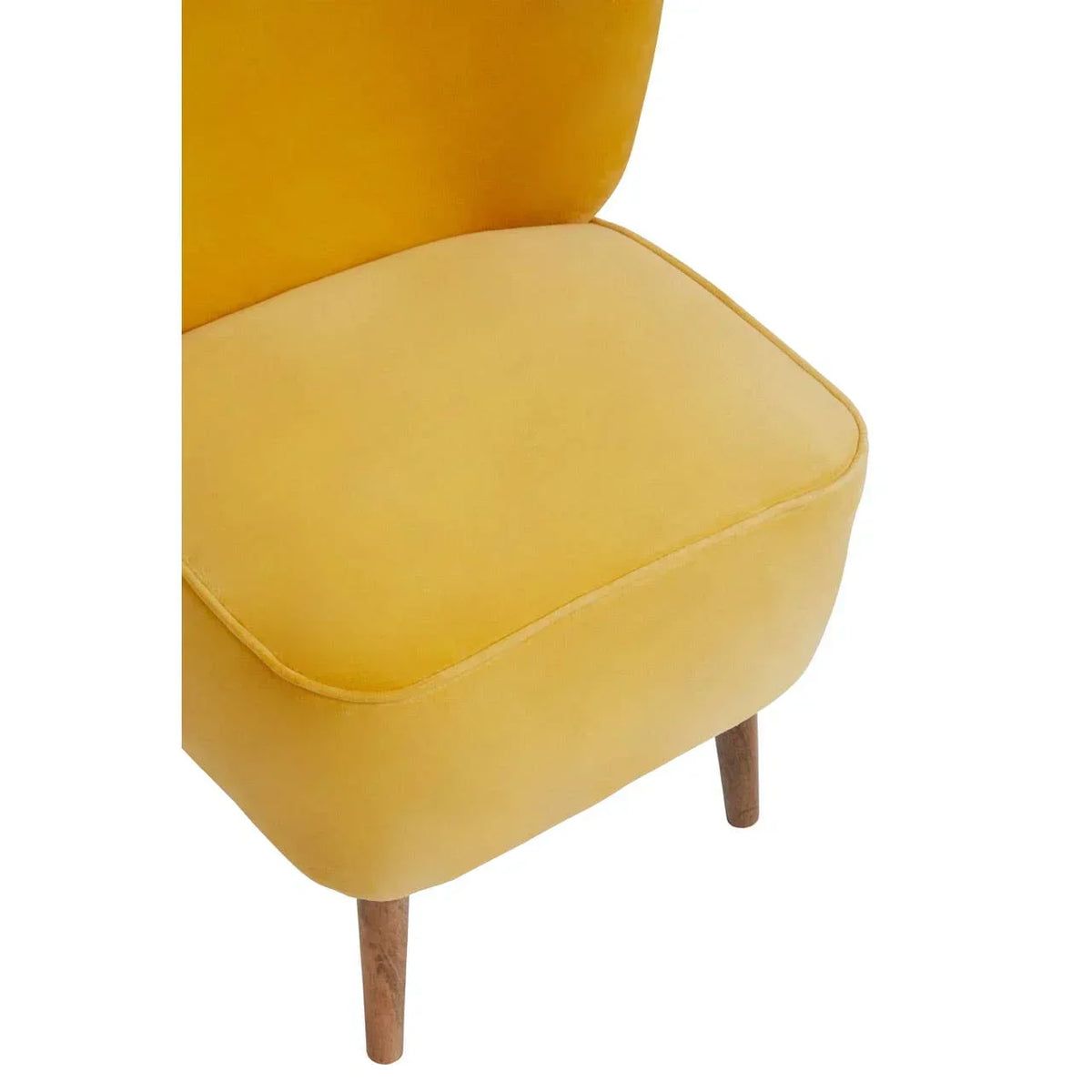 Yellow velvet accent chair with wooden legs, close-up of seat and fabric