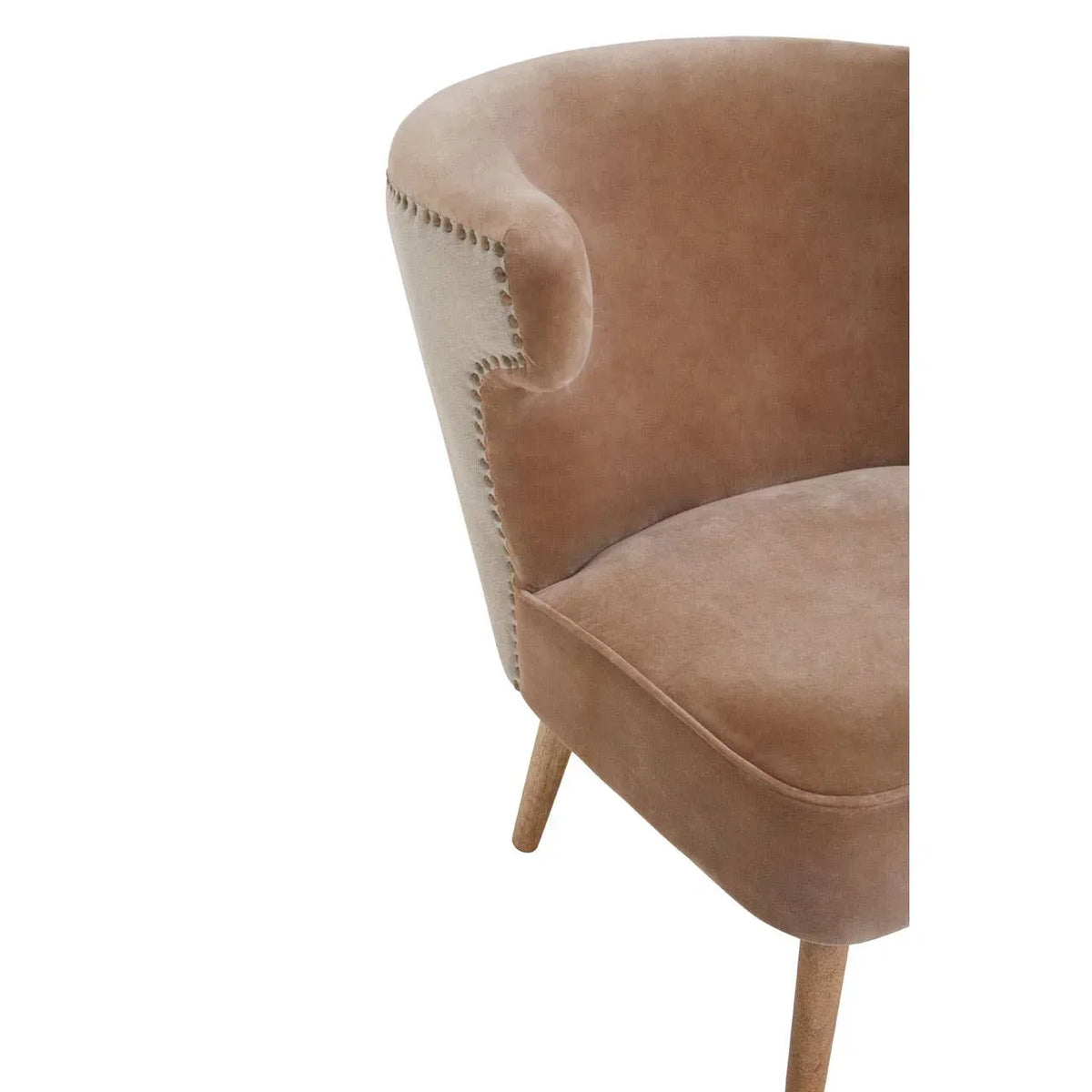 Close-up of brown upholstered armchair with wooden legs and studded trim