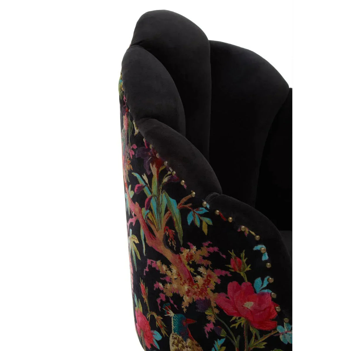 Velvet armchair with black scalloped backrest and floral patterned fabric detail