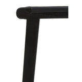 Close up of black wooden chair frame with smooth corner joint and upholstered seat edge